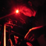 Cameraman Kevin Flay working under red lights to film invertebrates